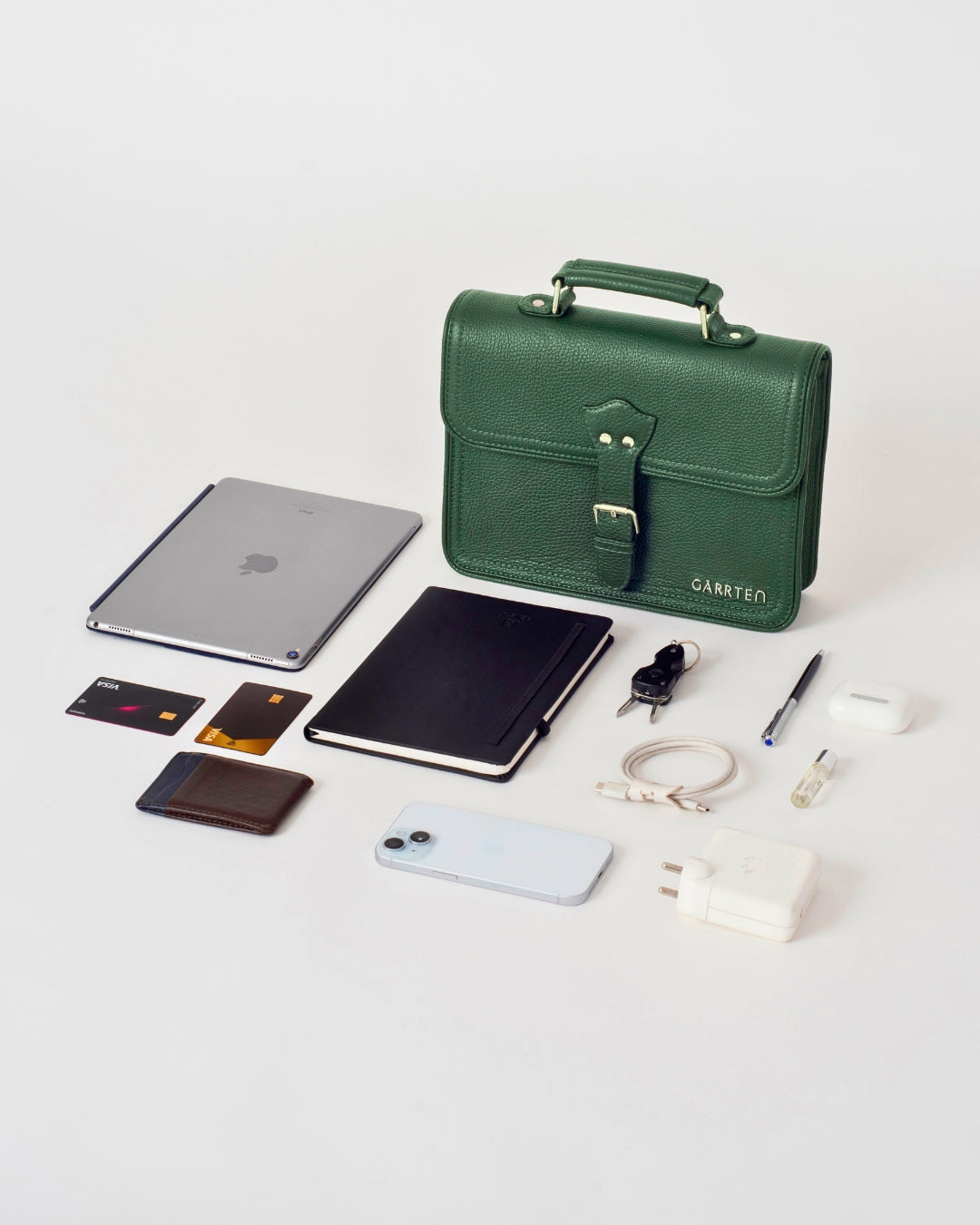 GARRTEN 538 forest green italian leather crossbody satchel bag — flatlay showing full exterior, detachable leather strap and polished silver magnetic snap buckle closure