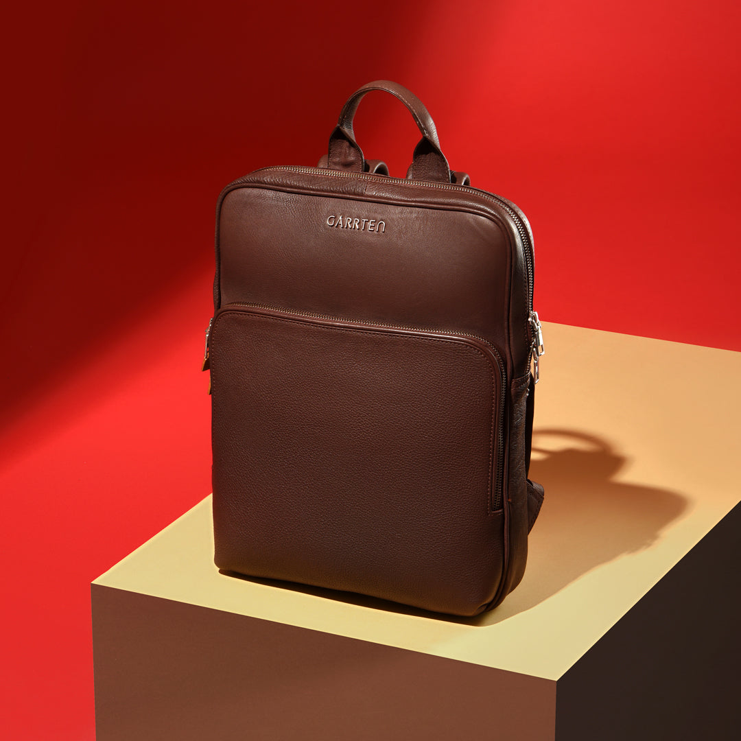 Vintage Mahogany Brown: tilted front view of Garrten slim full grain leather backpack