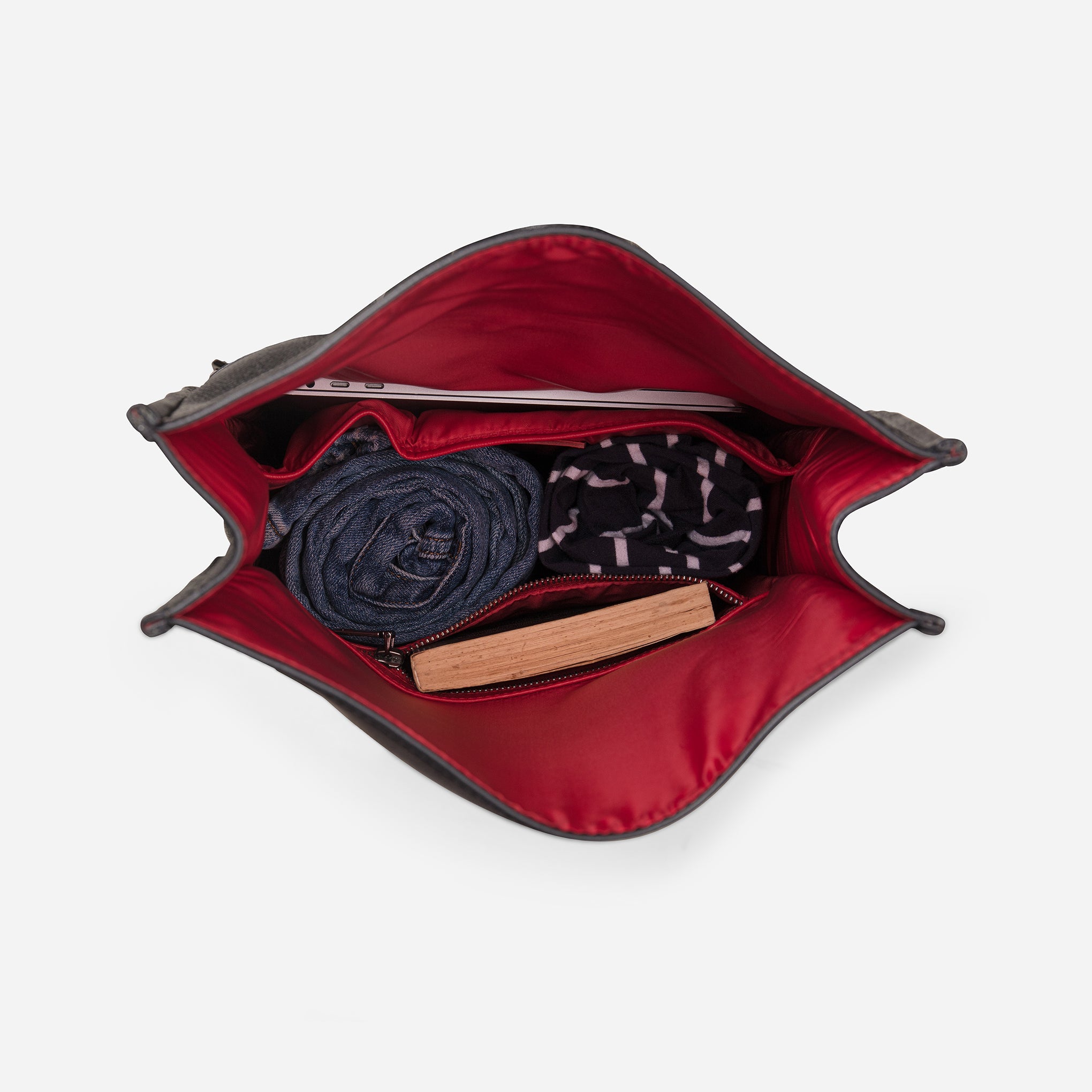 Carbon Black: top view showing inside capacity of Garrten rolltop style full grain leather backpack