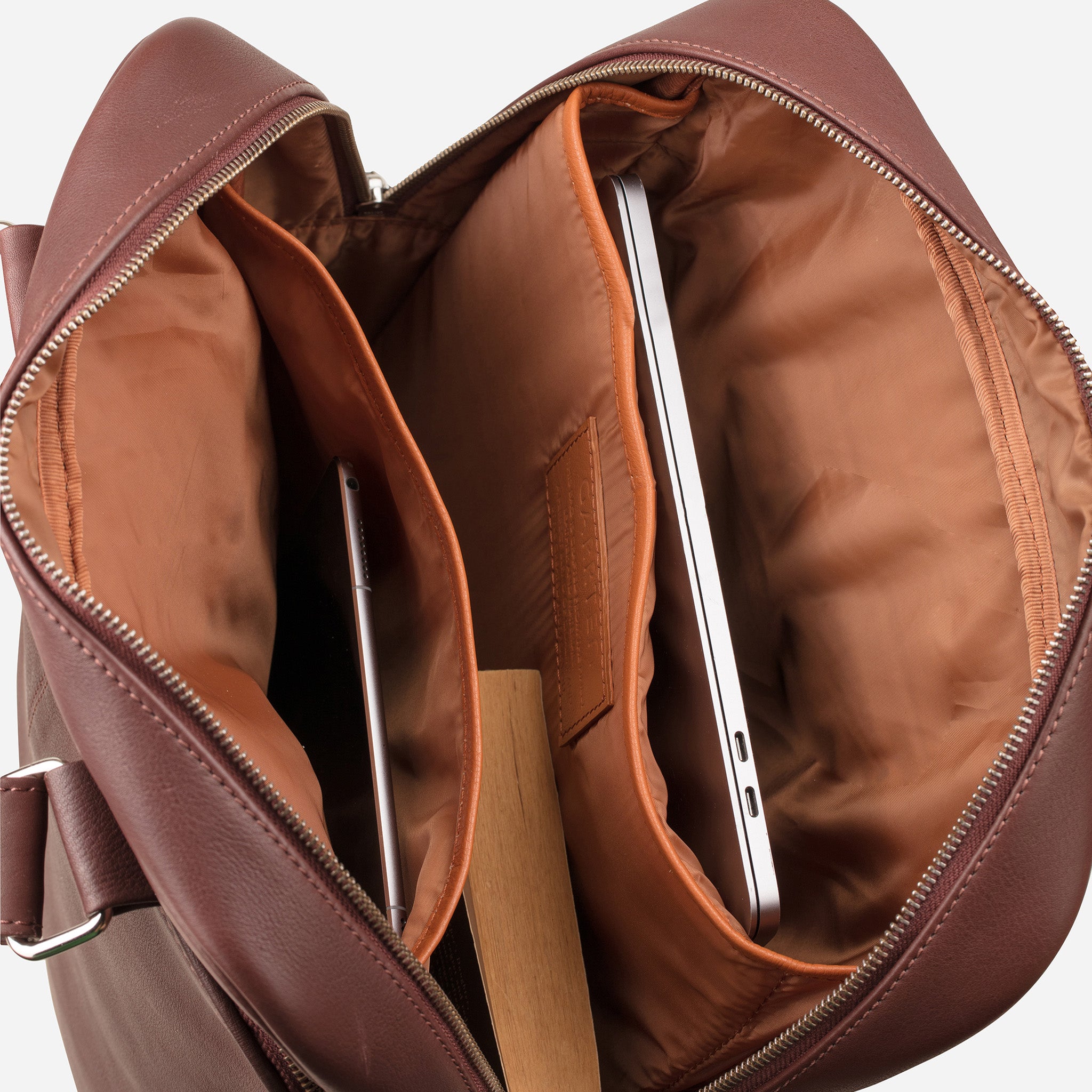 Vintage Mahogany Brown: top view showing inside laptop compartments of Garrten signature convertible full grain leather backpack