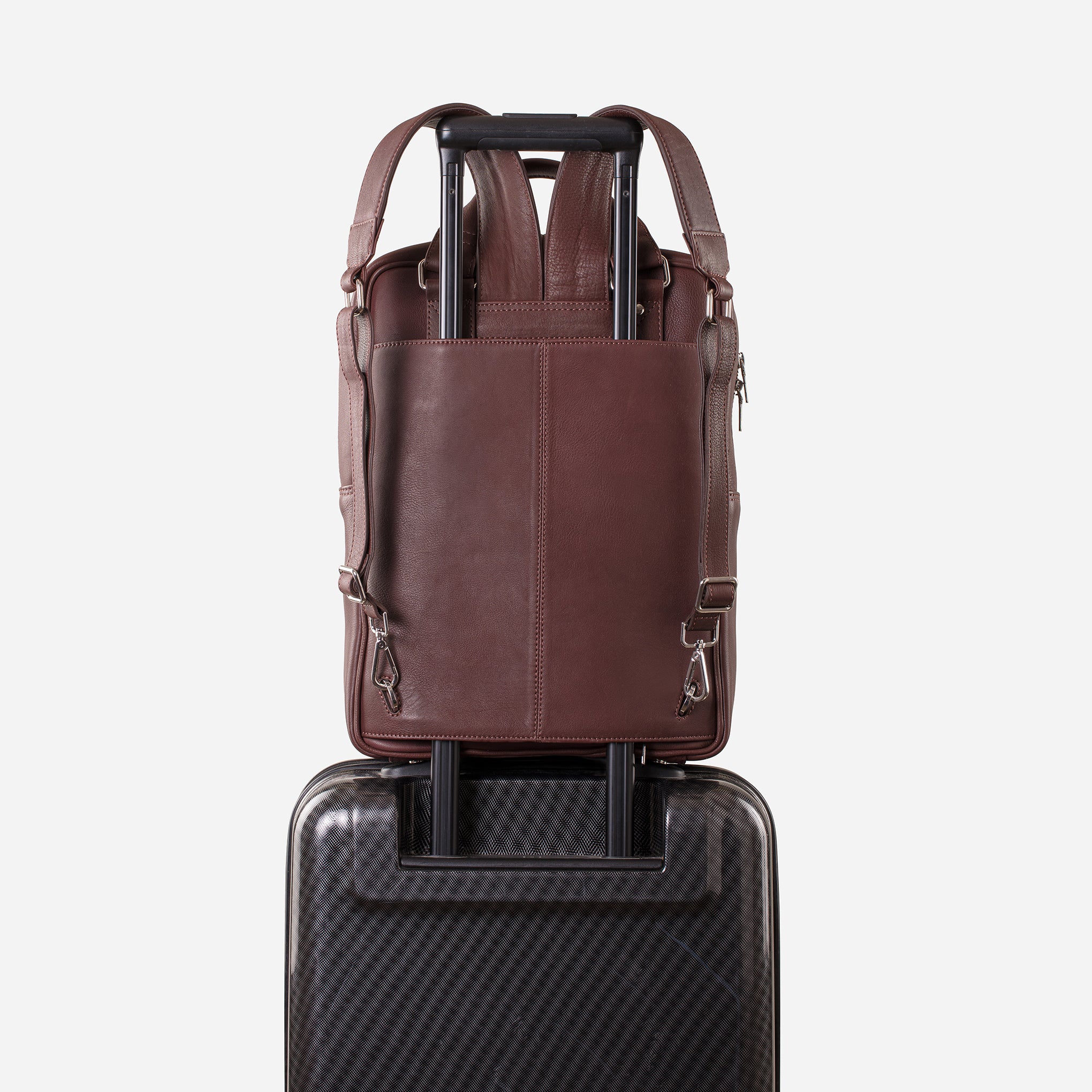 Mahogany Brown: back view showing trolley sleeve usage of Garrten signature convertible full grain leather backpack
