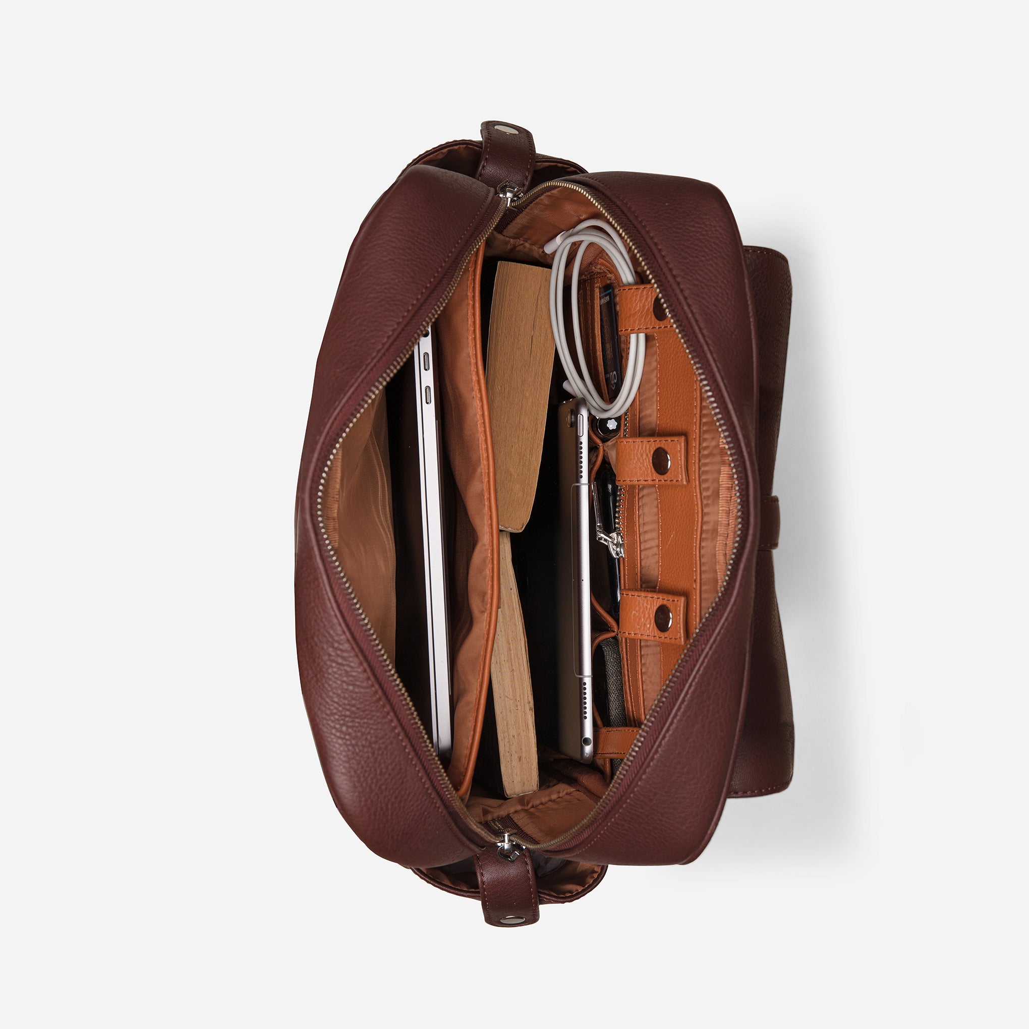 Vintage Mahogany Brown: top inside view showing cable loops, zipper pocket & laptop compartment of Garrten travel leather backpack