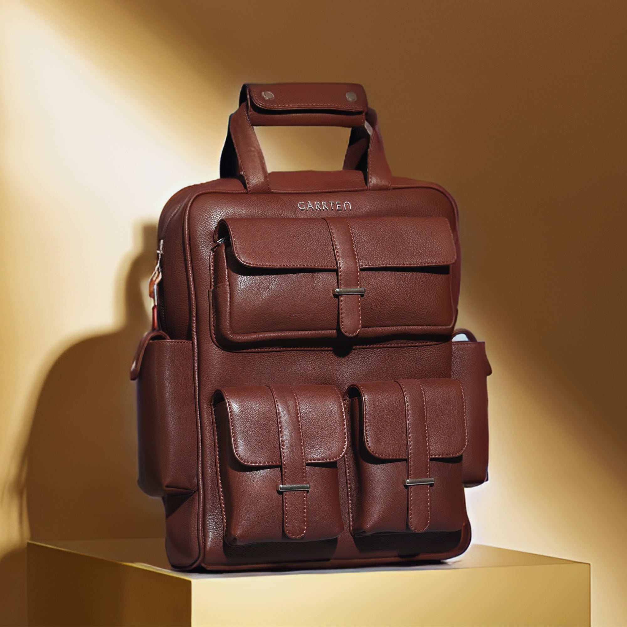 Vintage Mahogany Brown: tilted front view of Garrten travel full grain leather backpack