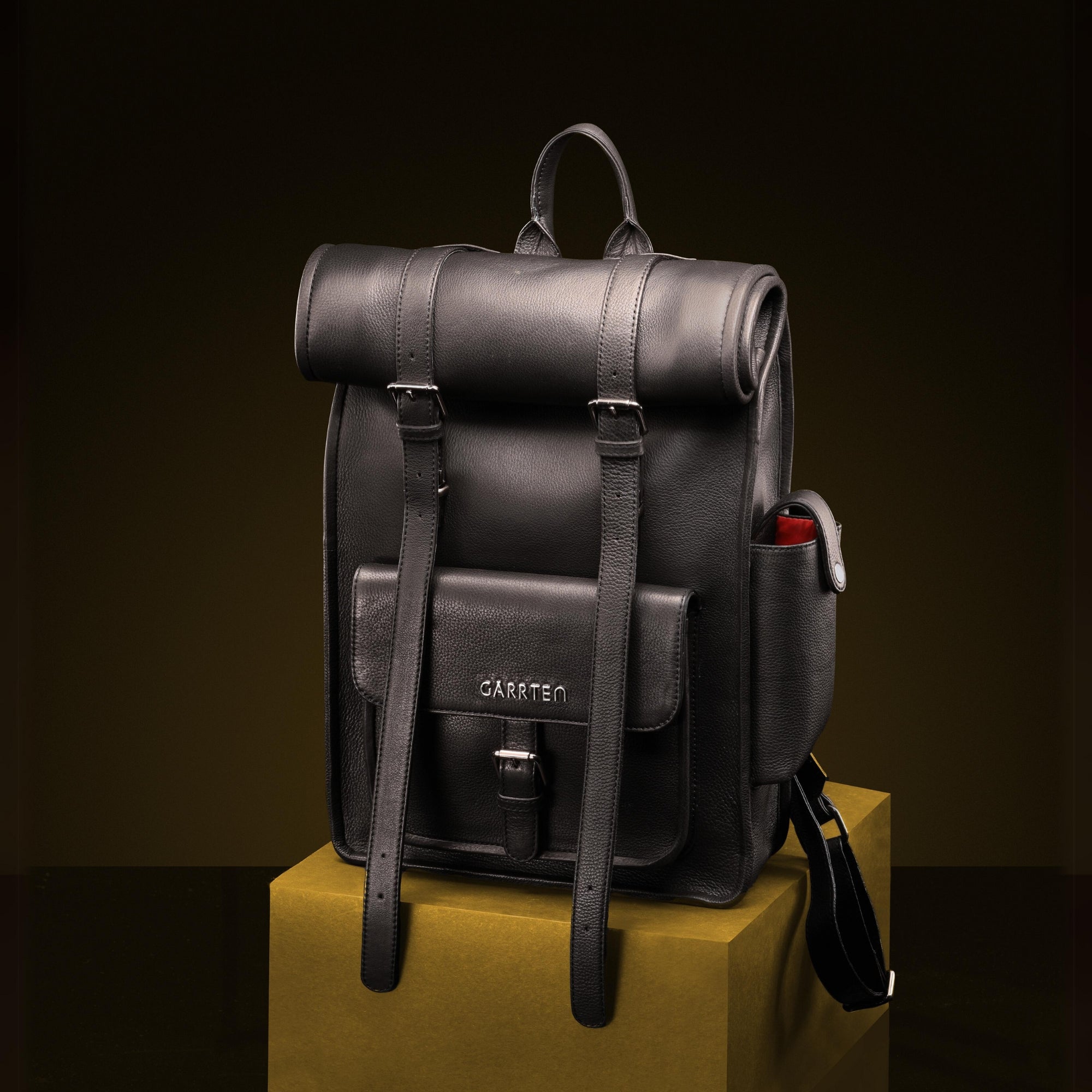 Carbon Black: front view of Garrten rolltop style full grain leather backpack-moodshot