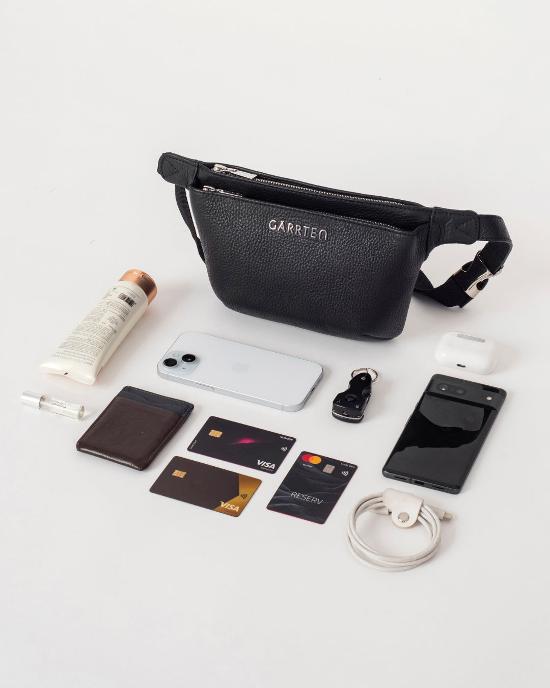 GARRTEN 528 leather crossbody belt bag in carbon black— flatlay 
