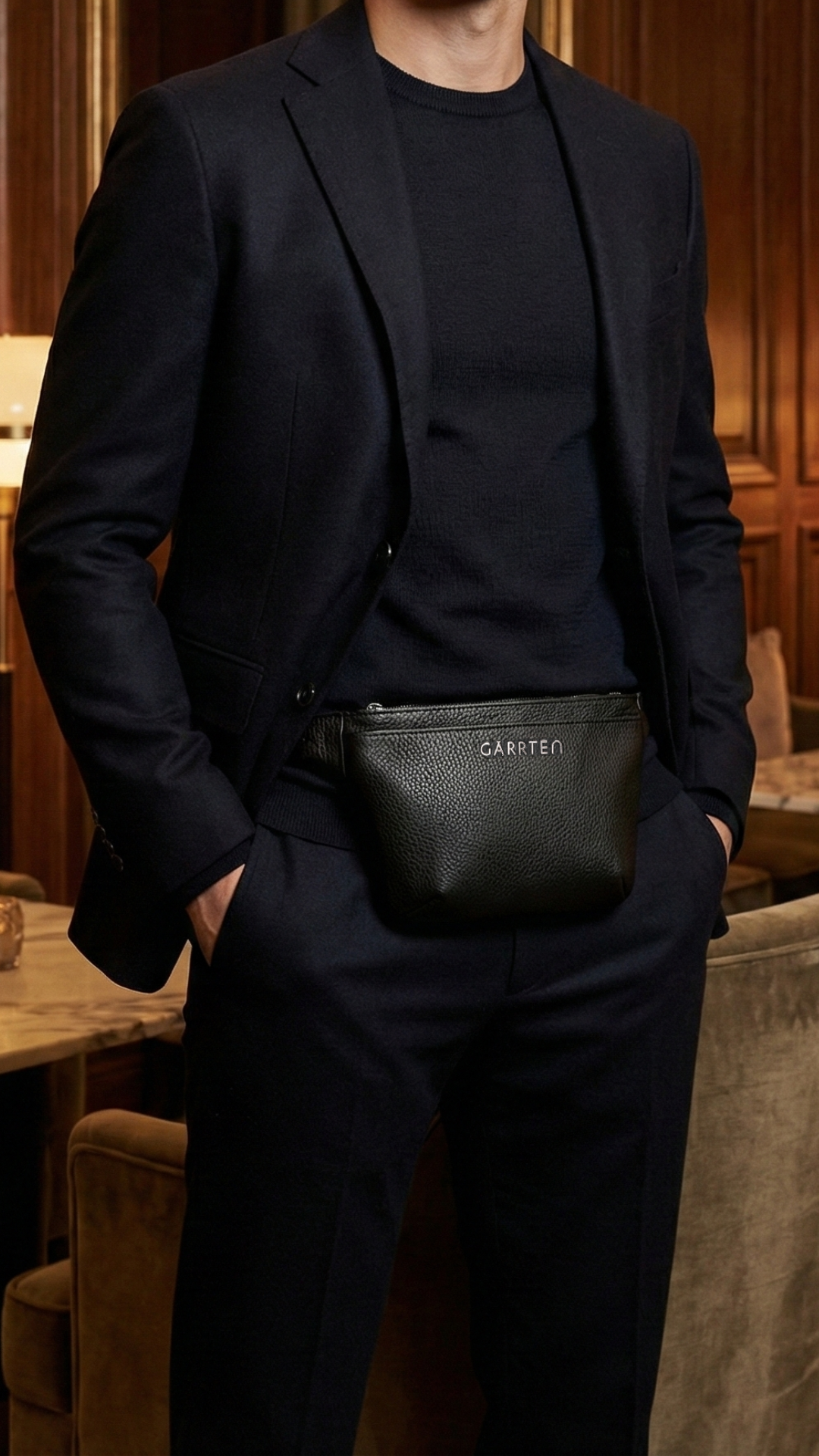 Garrten 528 Crossbody belt bag in black, worn by a man— lifestyle photograph
