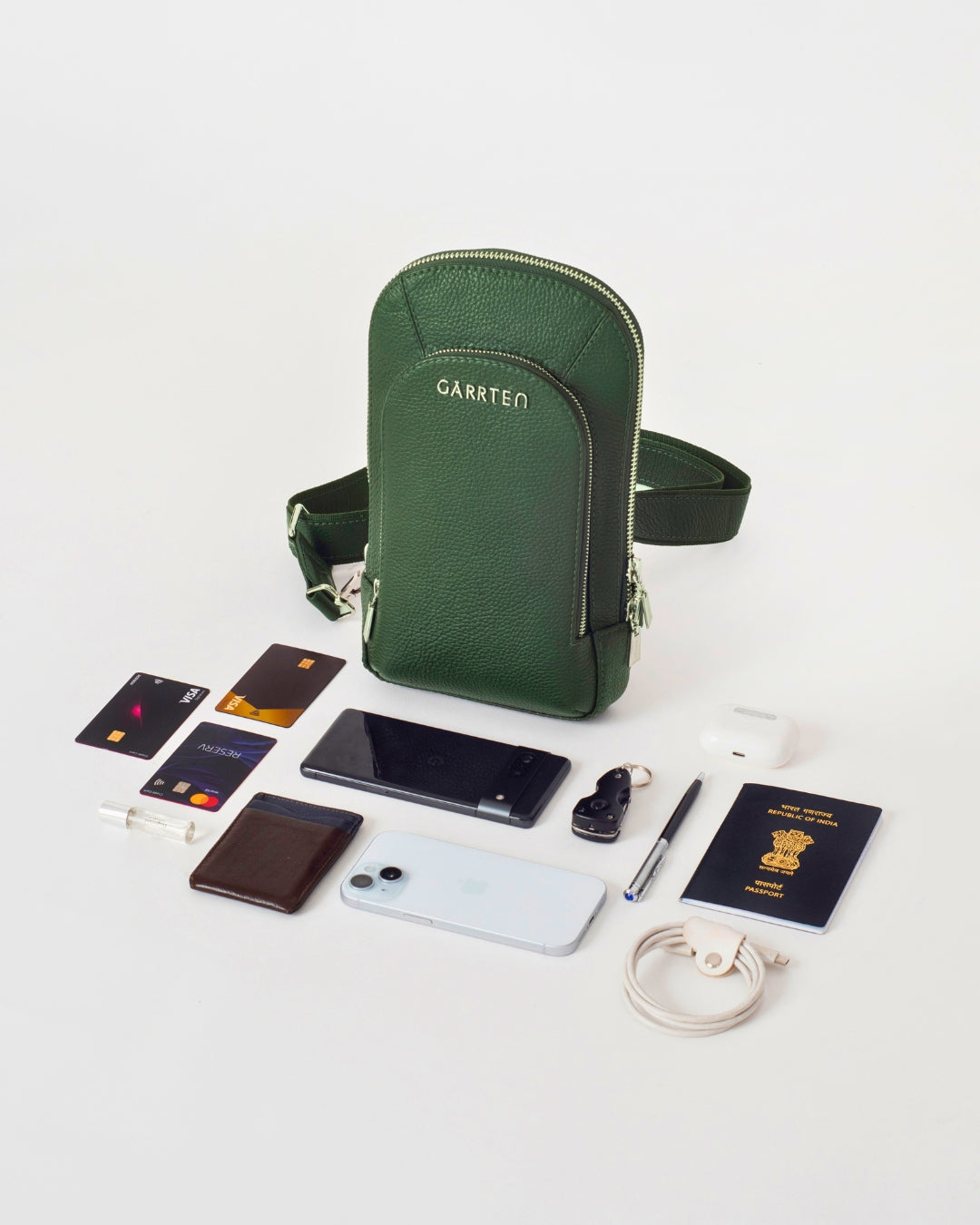 GARRTEN 518 forest green italian leather crossbody sling bag — flatlay showing the capacity