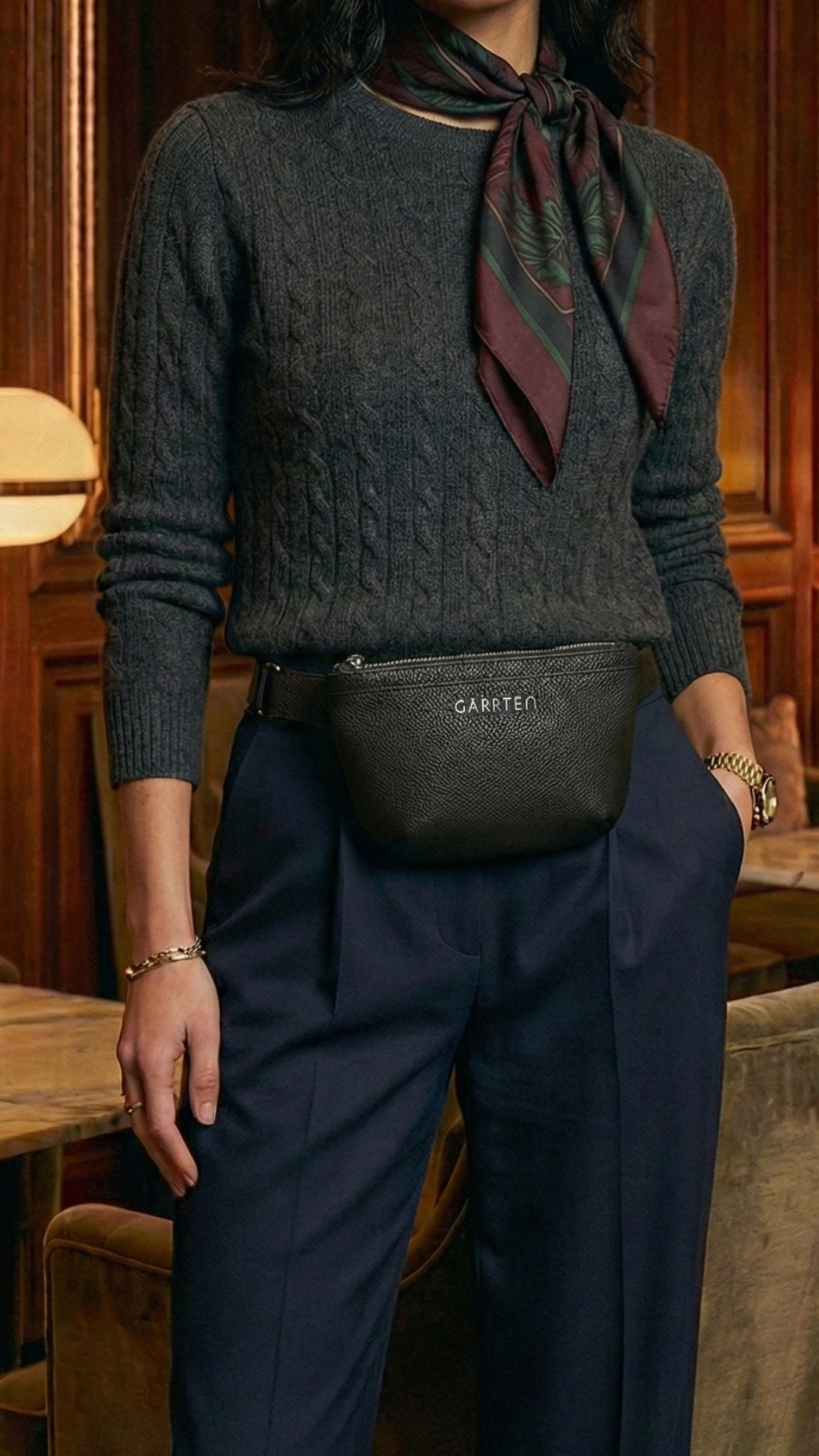 GARRTEN 528 Crossbody belt bag in black, worn by a woman — lifestyle photograph