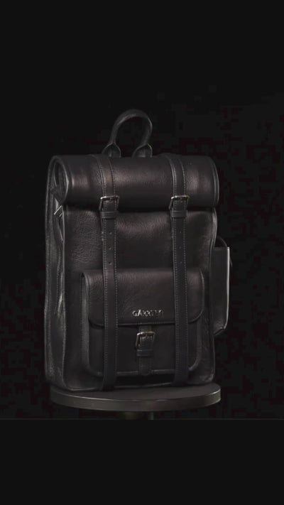 GARRTEN 751 ROLLTOP  leather backpack in midnight blue on a turn table— product video in vertical format showing bag 360 degree on a black background