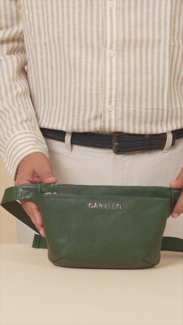 GARRTEN 528 leather crossbody belt bag in forest green — product video in vertical format showing bag features by a man in  smart casual off-white attire