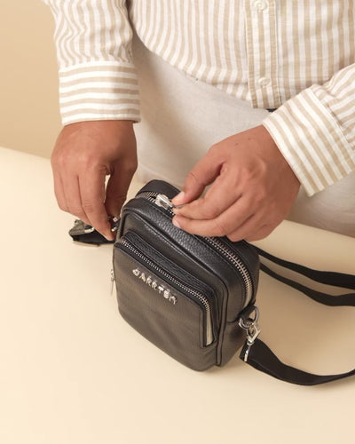 GARRTEN 508 mini carbon black leather crossbody bag — product video thumbnail showing strap adjustment and zip features