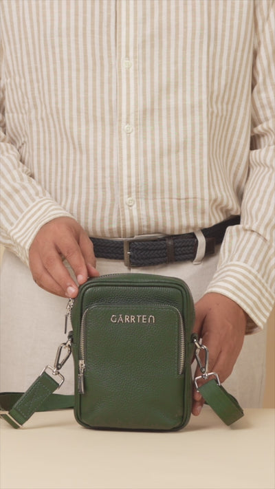 GARRTEN 508 leather mini crossbody in Forest Green— product video in vertical format showing bag features on a cream background