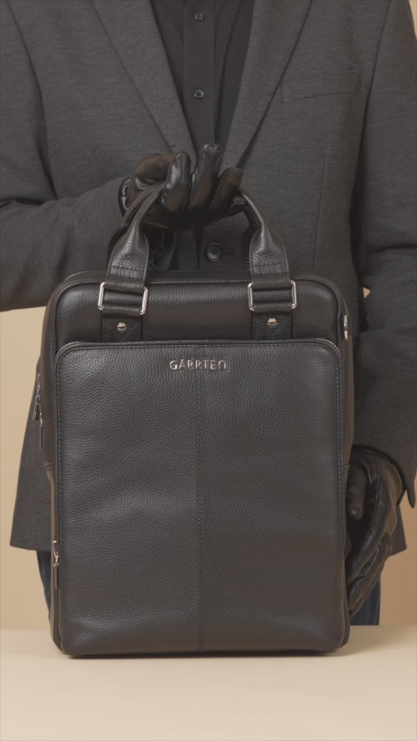 GARRTEN 821 signature italian leather backpack in carbon black — product video in vertical format showing backpack features on a beige background