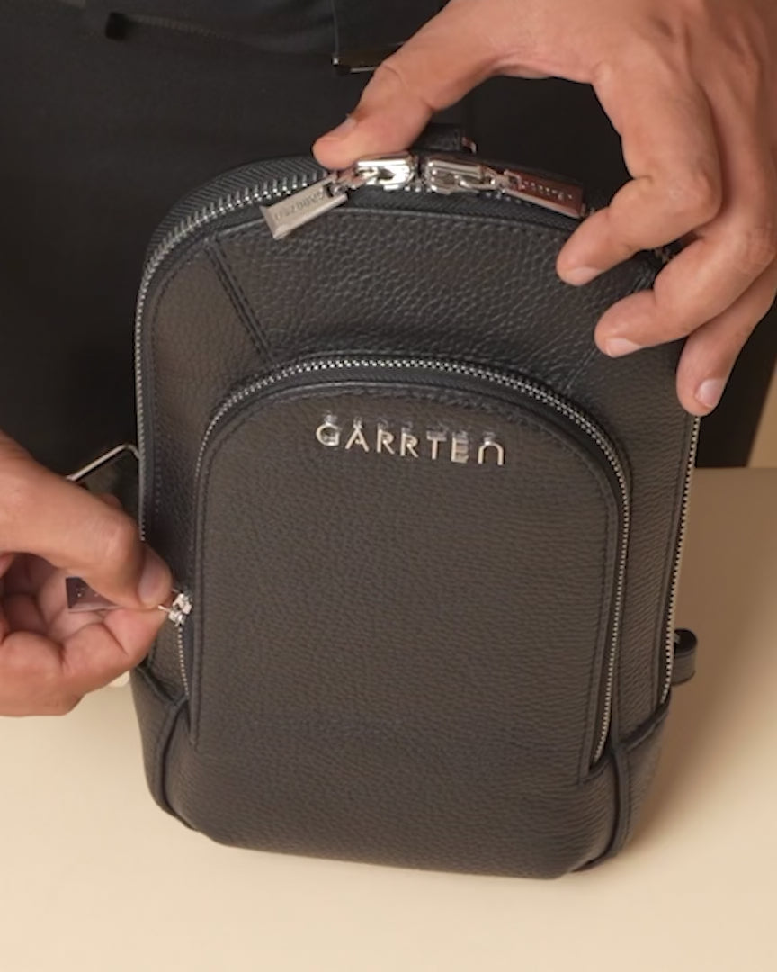 GARRTEN 518 carbon black italian leather crossbody sling bag — product video thumbnail showing woven strap adjustment and zipper pockets