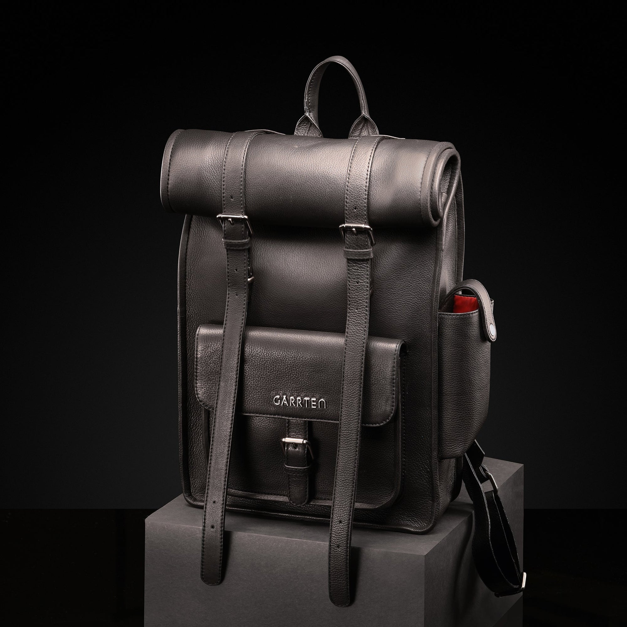 Black: front view of Garrten rolltop style full grain leather backpack-moodshot