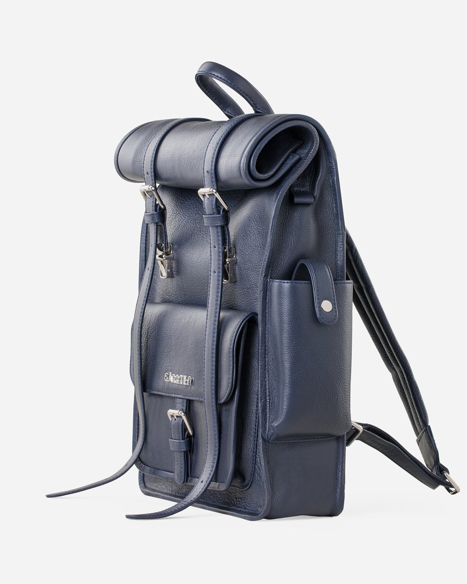 Blue: right side view showing outer pocket of Garrten rolltop style full grain leather backpack
