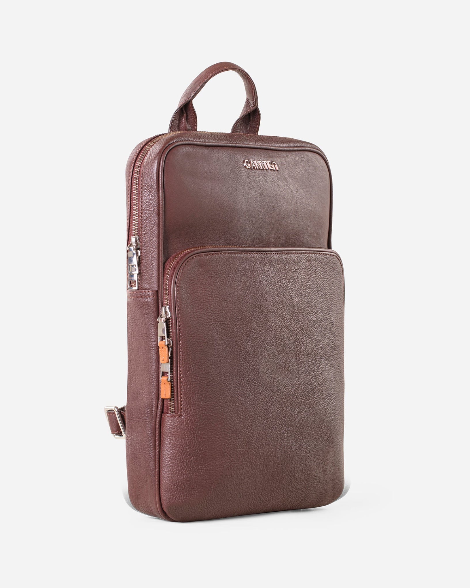 GARRTEN 731 slim full-grain leather backpack in vintage mahogany brown — tilt view showing structured slim profile , white background